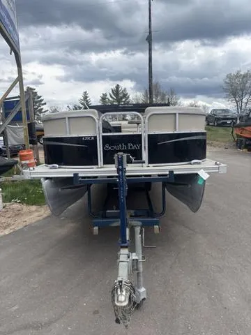 Slide: The Image of 2015 South Bay 420 CR pontoon boat on trailer under cloudy sky. - 3