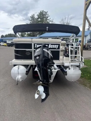 Slide: The Image of 2015 South Bay 420 CR pontoon boat with Mercury outboard motor, parked on a paved surface. - 7