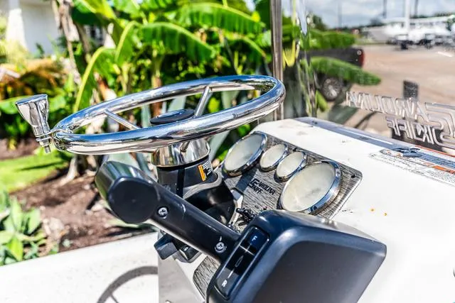 Slide: The Image of 2018 Carolina Skiff 16JVX boat dashboard with steering wheel and gauges. - 7