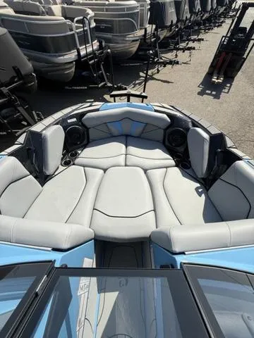 Slide: The Image of 2025 Centurion Fe25 boat interior with plush seating and modern design. - 9