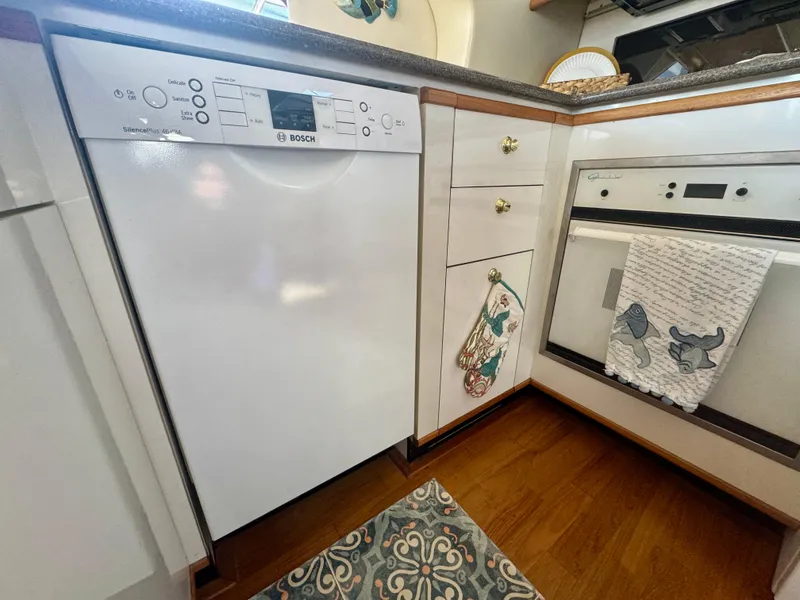 Slide: The Image of Kitchen area in a 1999 Bayliner 5288 Pilot House Motoryacht with Bosch dishwasher. - 11