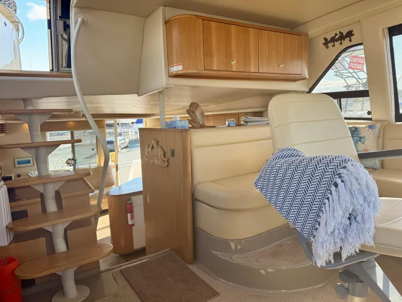 Slide: The Image of Interior of 1999 Bayliner 5288 Pilot House Motoryacht with seating and stairs. - 15