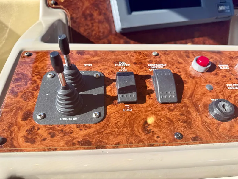 Slide: The Image of Control panel of a 1999 Bayliner 5288 Pilot House Motoryacht with thruster and switches. - 19