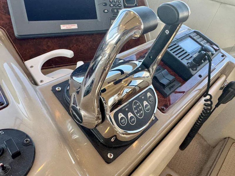 Slide: The Image of Control panel of a 1999 Bayliner 5288 Pilot House Motoryacht with chrome throttle levers. - 21