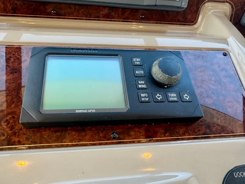 Slide: The Image of Control panel of a 1999 Bayliner 5288 Pilot House Motoryacht with Simrad AP25 display. - 22