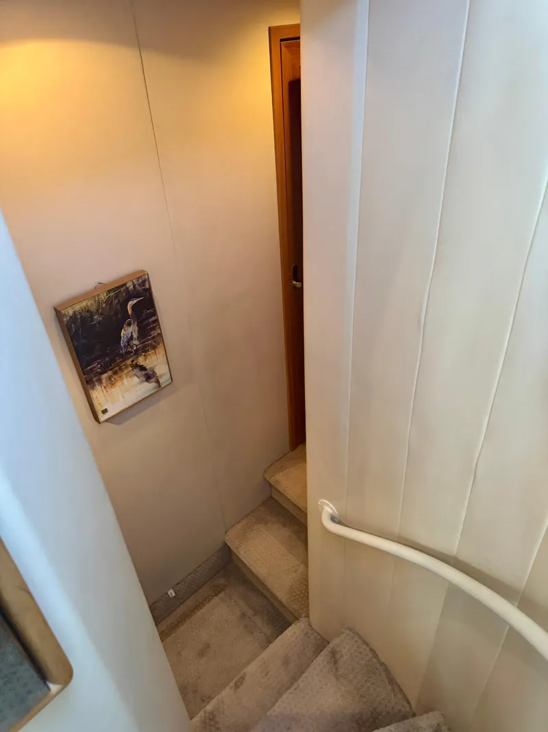 Slide: The Image of Staircase inside 1999 Bayliner 5288 Pilot House Motoryacht with wall art. - 26