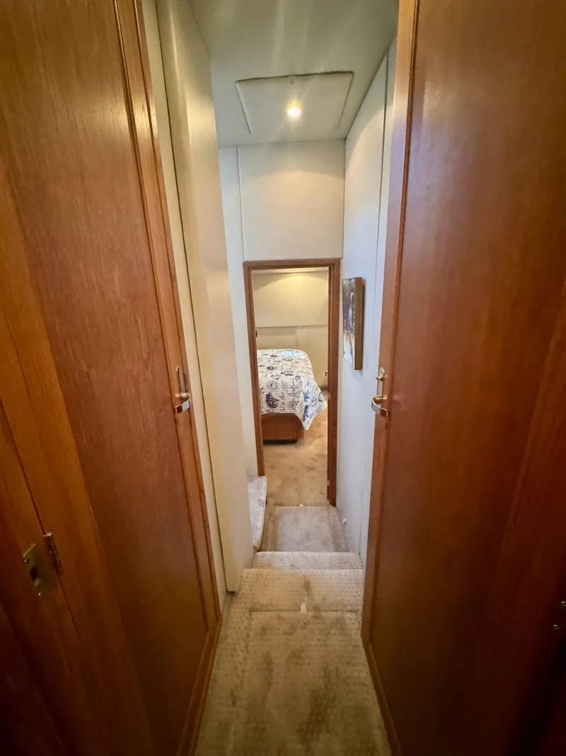 Slide: The Image of Hallway leading to bedroom in 1999 Bayliner 5288 Pilot House Motoryacht. - 27