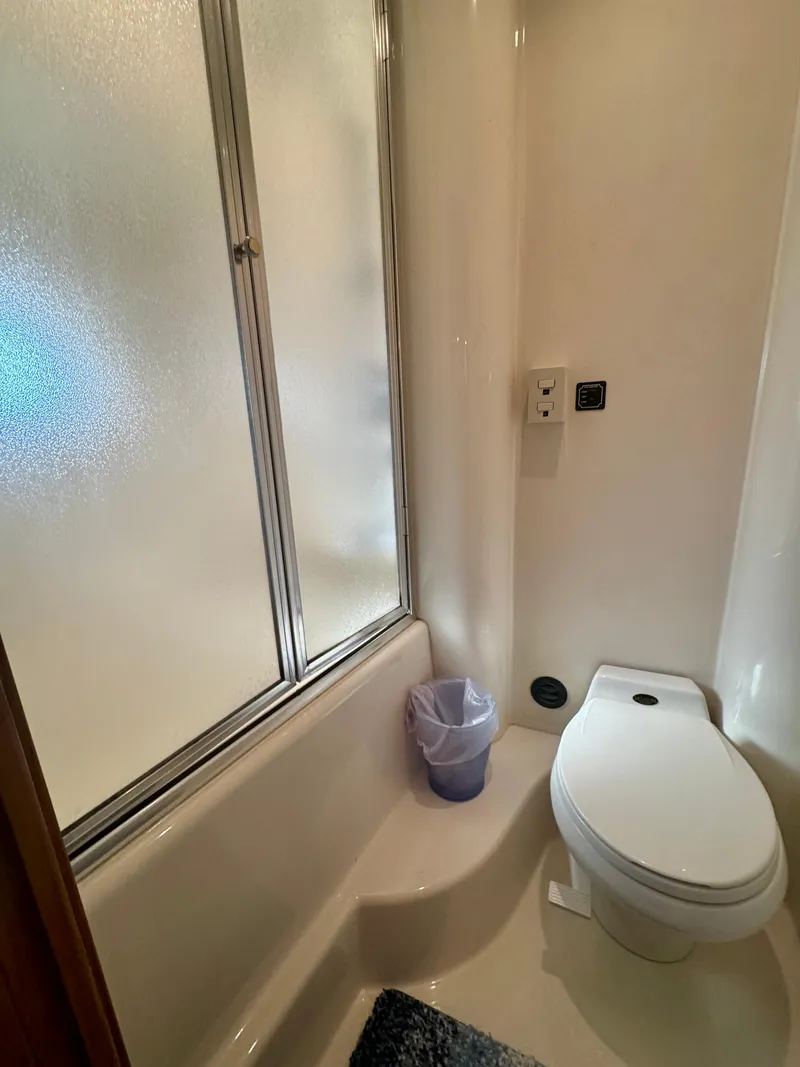 Slide: The Image of Bathroom in 1999 Bayliner 5288 Pilot House Motoryacht with shower and toilet. - 33