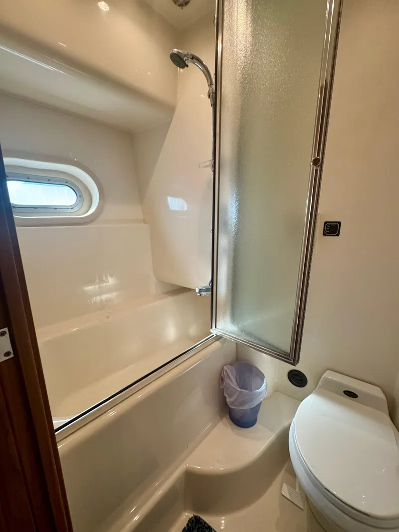 Slide: The Image of Bathroom in 1999 Bayliner 5288 Pilot House Motoryacht with shower and toilet. - 34