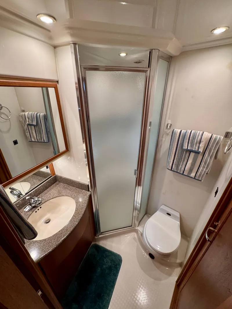 Slide: The Image of 1999 Bayliner 5288 Pilot House Motoryacht bathroom with shower, sink, and toilet. - 37