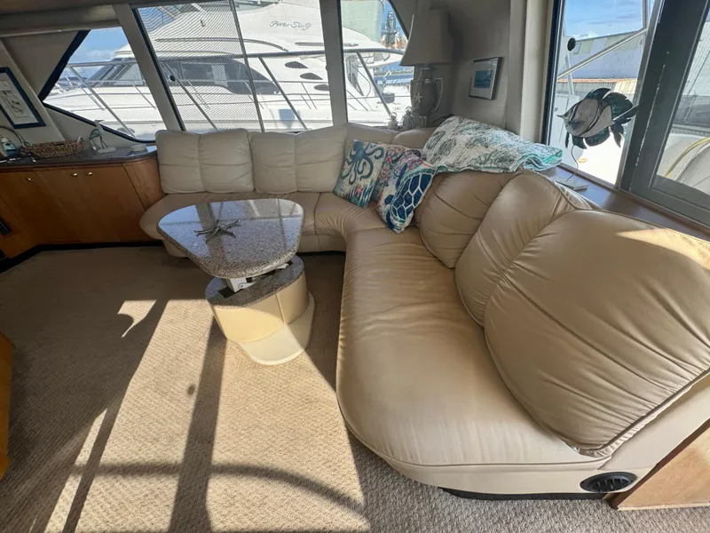 Slide: The Image of Luxurious interior of 1999 Bayliner 5288 Pilot House Motoryacht with plush seating and elegant decor. - 4