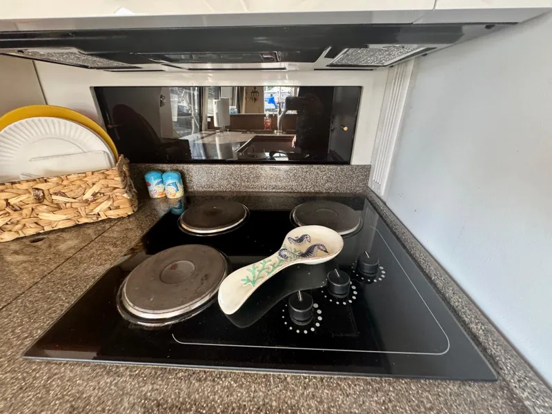 Slide: The Image of Stovetop in 1999 Bayliner 5288 Pilot House Motoryacht kitchen with ceramic spoon rest. - 9