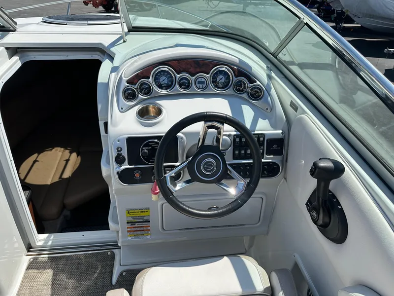 Slide: The Image of 2019 Crownline 236 SC boat dashboard with steering wheel and instrument panel. - 10