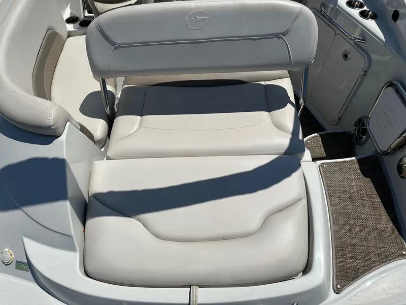 Slide: The Image of 2019 Crownline 236 SC boat interior with white cushioned seating. - 5