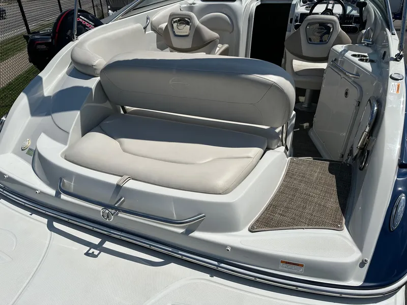 Slide: The Image of 2019 Crownline 236 SC boat interior with white seating and helm. - 6
