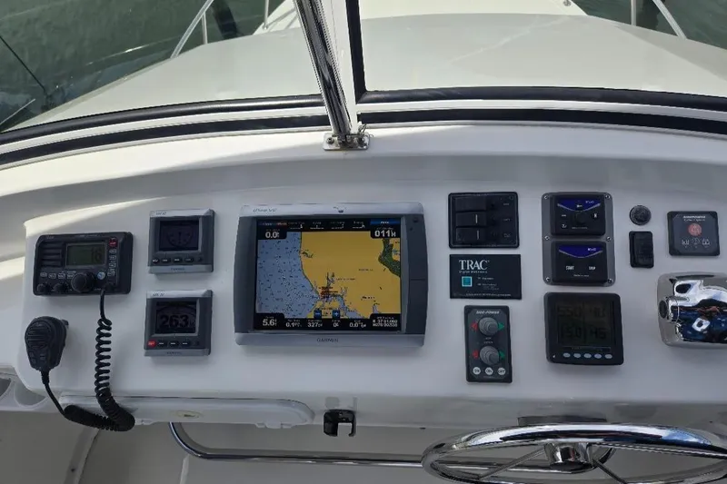 Slide: The Image of Control panel of a 2010 American Tug 49 Limited with navigation and communication equipment. - 10