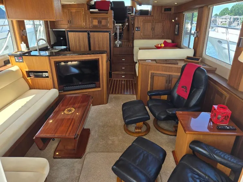 Slide: The Image of Luxurious interior of a 2010 American Tug 49 Limited yacht with elegant wood finishes. - 2
