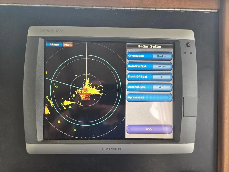 Slide: The Image of Garmin radar display on 2010 American Tug 49 Limited, showing radar setup and navigation details. - 33