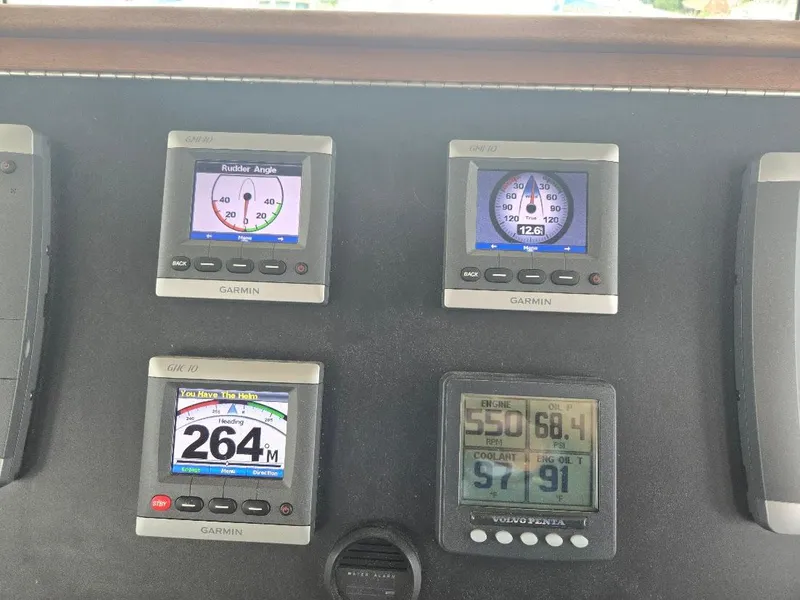 Slide: The Image of Control panel of a 2010 American Tug 49 Limited with Garmin navigation displays. - 37