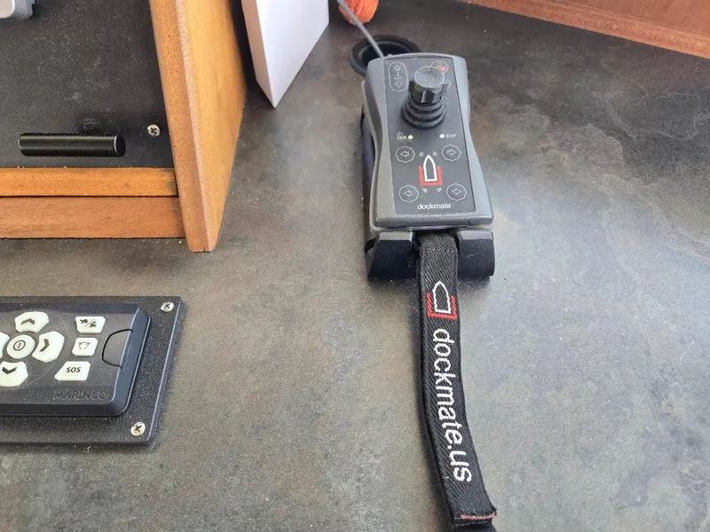 Slide: The Image of Dockmate remote control on American Tug 49 Limited, 2010 model, with joystick and strap. - 39