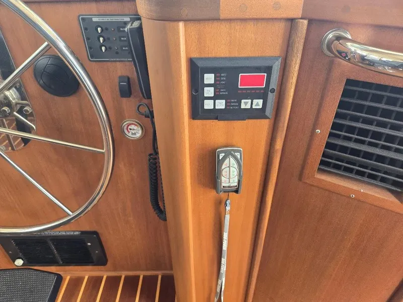 Slide: The Image of Control panel and steering wheel of a 2010 American Tug 49 Limited boat. - 42