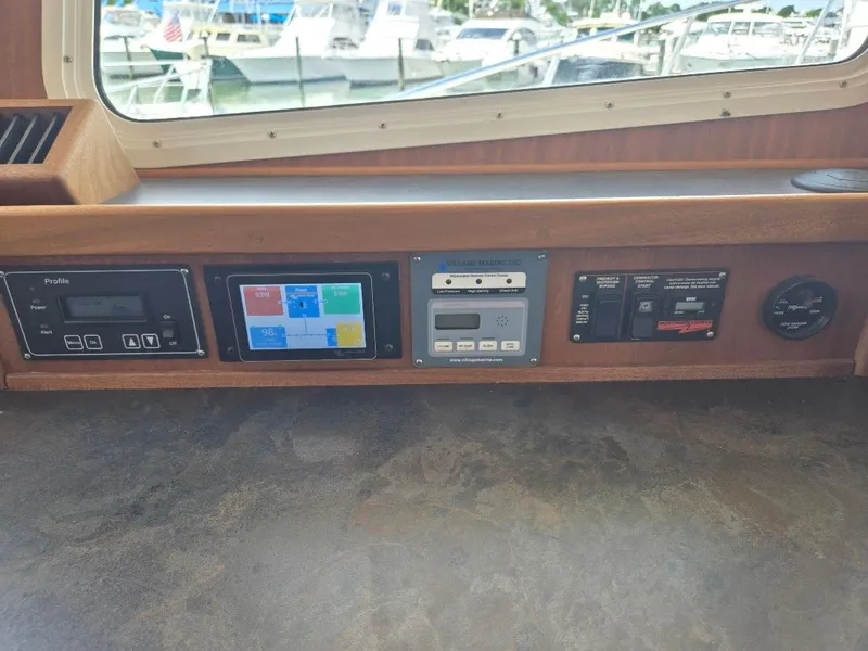 Slide: The Image of Control panel of a 2010 American Tug 49 Limited boat with various instruments. - 46