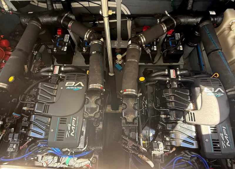 Slide: The Image of Engine compartment of a 1999 Sea Ray 340 Sundancer with twin V8 engines. - 30