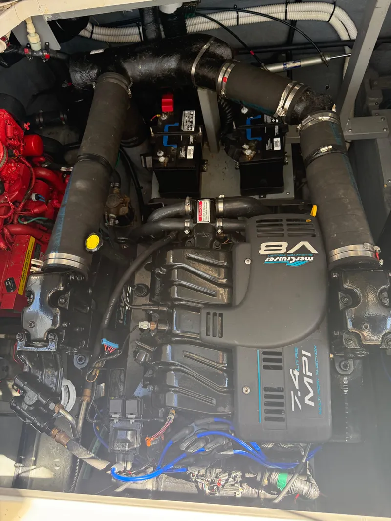 Slide: The Image of Engine compartment of a 1999 Sea Ray 340 Sundancer with a V8 MerCruiser engine. - 32