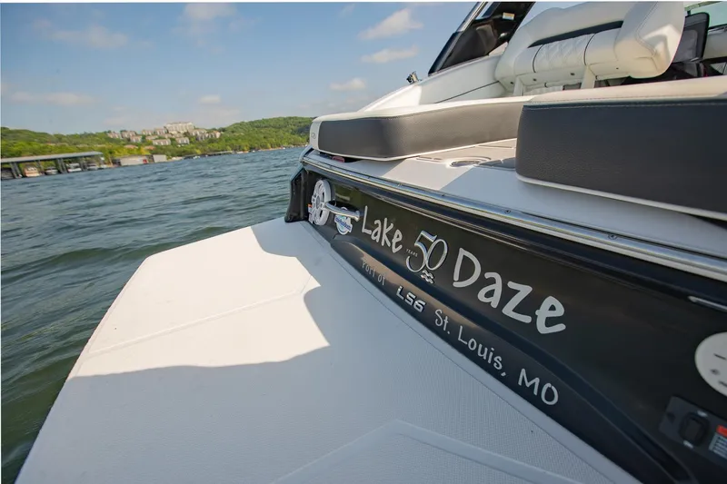 Slide: The Image of 2021 Regal LS6 boat on water, "Lake Daze" text, St. Louis, MO backdrop. - 11