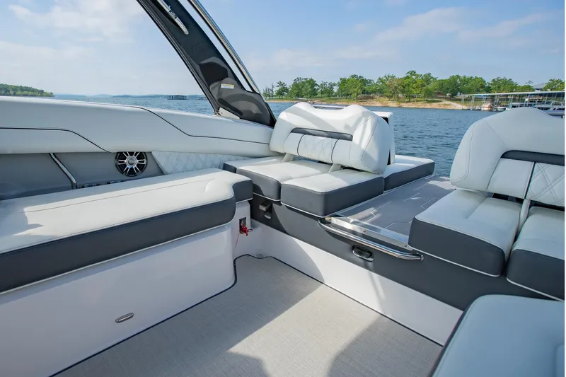 Slide: The Image of Luxurious 2021 Regal LS6 boat interior with plush seating and scenic water view. - 16