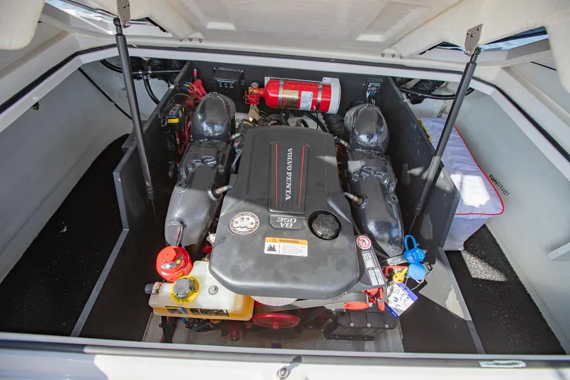 Slide: The Image of 2021 Regal LS6 engine compartment with Volvo Penta engine and fire extinguisher. - 33