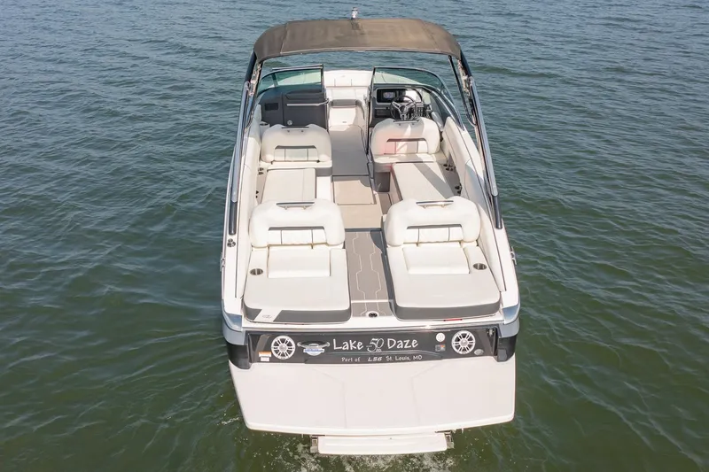 Slide: The Image of 2021 Regal LS6 boat on water, featuring spacious seating and sleek design. - 6