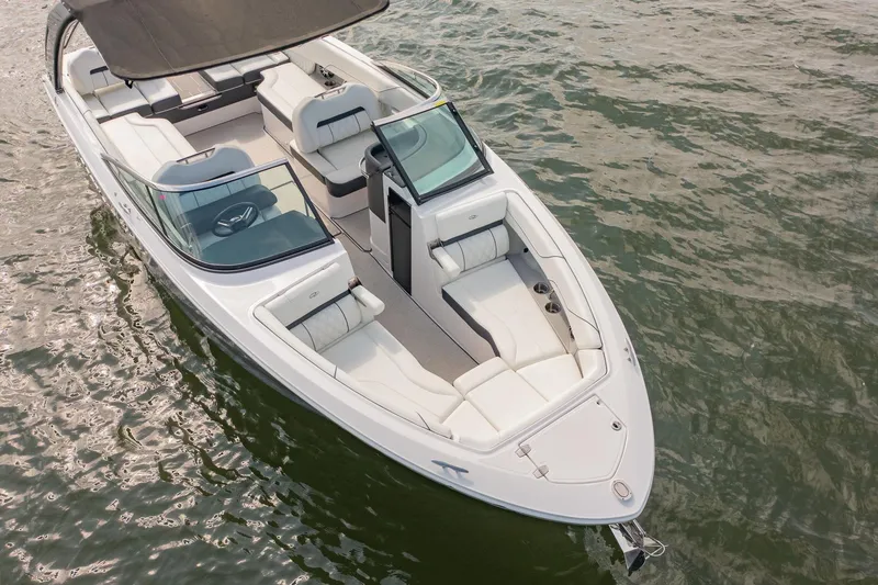 Slide: The Image of 2021 Regal LS6 boat on water, featuring sleek design and spacious seating. - 7