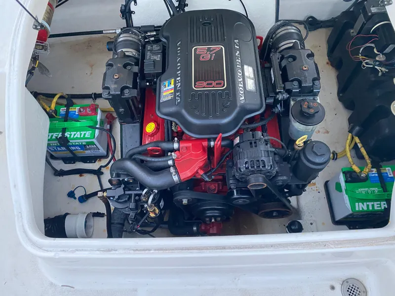 Slide: The Image of Engine compartment of a 2008 Chaparral Sunesta 244 boat with visible Interstate batteries. - 12