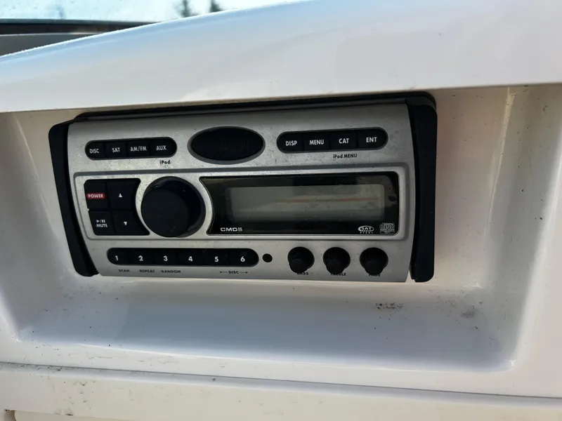 Slide: The Image of 2008 Chaparral Sunesta 244 boat stereo system with control panel and display. - 18