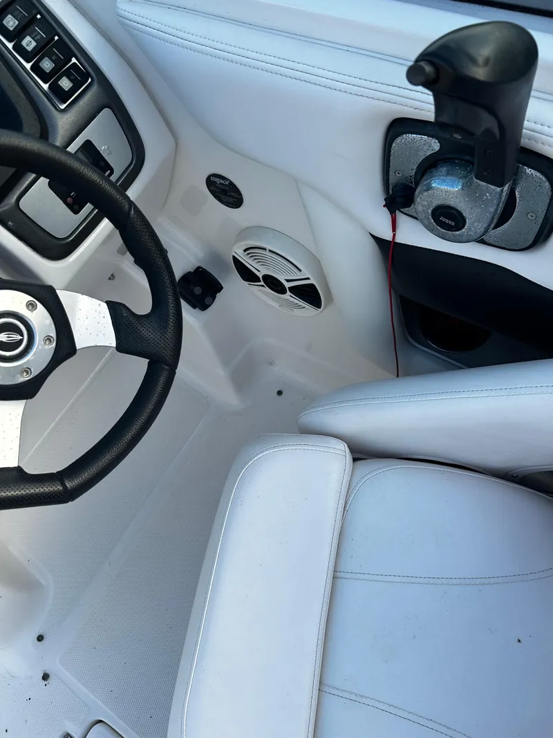 Slide: The Image of 2008 Chaparral Sunesta 244 boat interior with steering wheel and controls. - 25