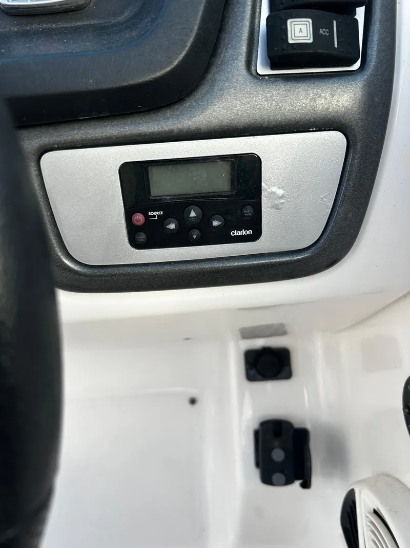 Slide: The Image of Control panel of a 2008 Chaparral Sunesta 244 boat with Clarion audio system. - 26