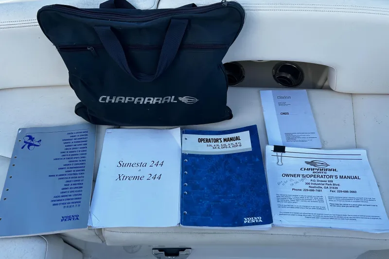 Slide: The Image of Chaparral Sunesta 244 manuals and bag on boat seat, 2008 model. - 28