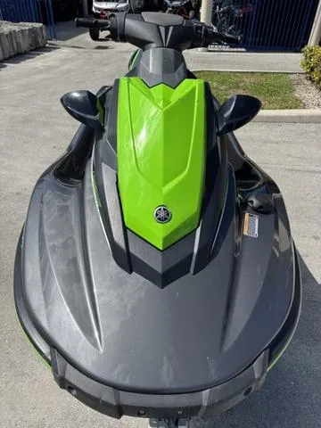Slide: The Image of 2018 Yamaha WaveRunner EX, green and black, parked on concrete surface. - 3