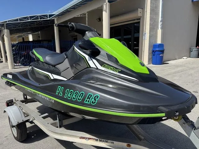 Slide: The Image of 2018 Yamaha WaveRunner EX jet ski in black and green on a trailer. - 4
