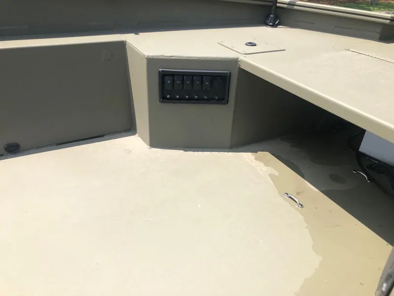 Slide: The Image of 2025 Tracker Grizzly 1650 T Prairie Wings Edition boat interior with control panel. - 12