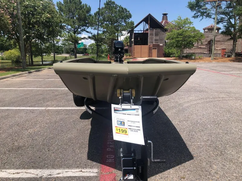 Slide: The Image of 2025 Tracker Grizzly 1650 T Prairie Wings Edition boat in parking lot, price tag visible. - 8