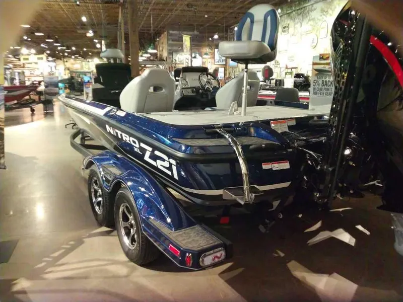 Slide: The Image of 2025 Nitro Z21 XL Pro boat displayed indoors, showcasing sleek design and modern features. - 3