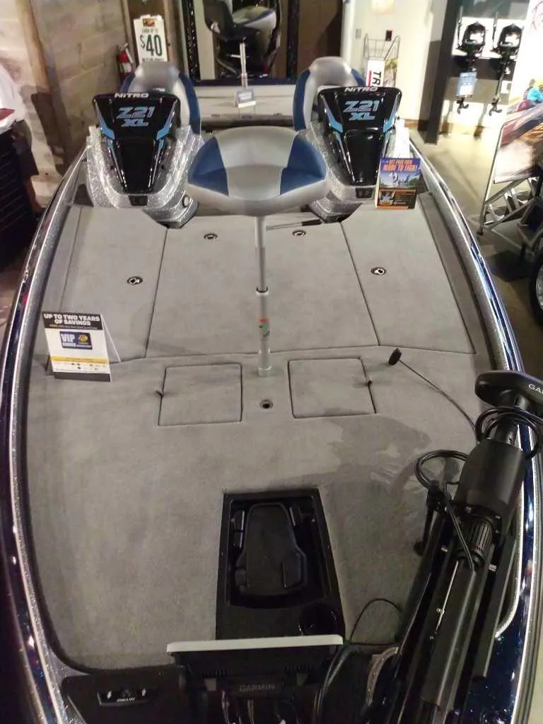 Slide: The Image of 2025 Nitro Z21 XL Pro fishing boat interior with dual seats and equipment. - 4