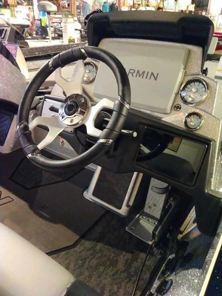 Slide: The Image of 2025 Nitro Z21 XL Pro boat dashboard with Garmin display and steering wheel. - 5