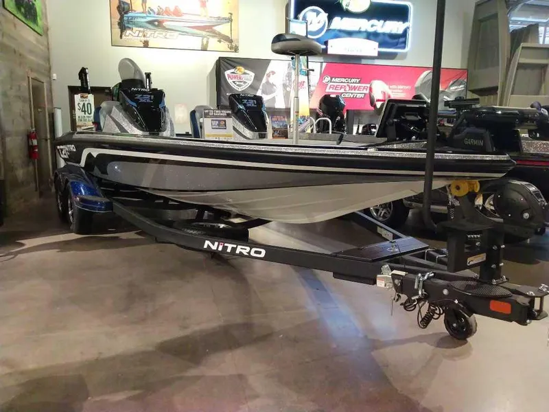 Slide: The Image of 2025 Nitro Z21 XL Pro boat displayed in showroom with sleek design and modern features. - 6