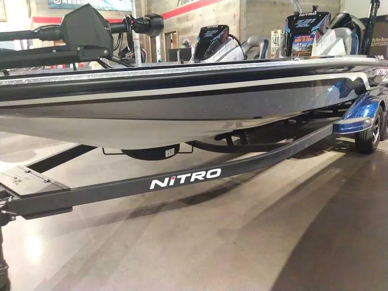 Slide: The Image of 2025 Nitro Z21 XL Pro boat displayed indoors on a trailer. - 8