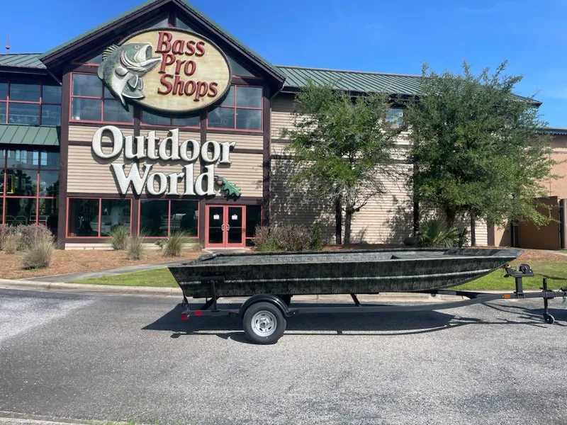 The Image of 2025 Tracker GRIZZLY 1860 Utility boat on trailer outside Bass Pro Shops Outdoor World. - 0