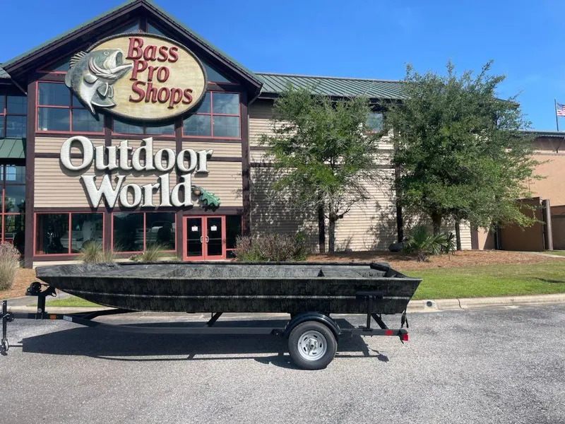 Slide: The Image of 2025 Tracker GRIZZLY 1860 Utility boat outside Bass Pro Shops Outdoor World. - 5