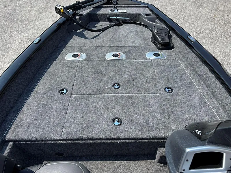 Slide: The Image of 2025 Tracker Pro Team 175 Crappie Edition boat deck with fishing rod holders. - 11